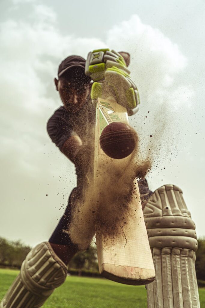 low angle shot of man playing cricket