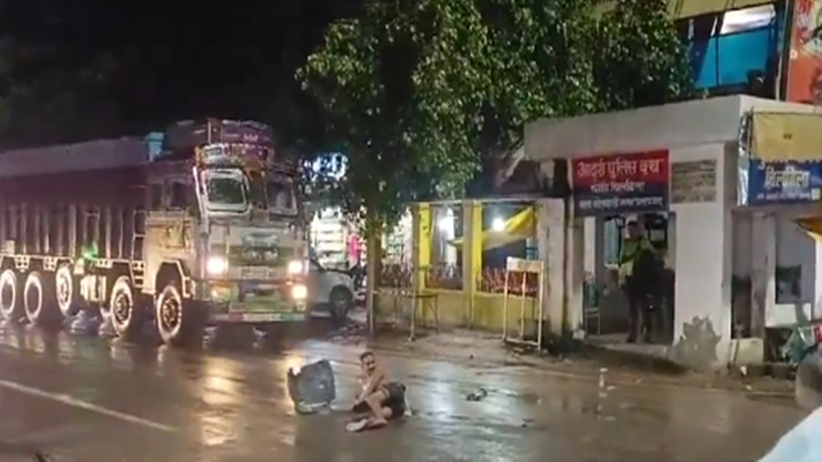 Truck Hits Man Sitting on Road